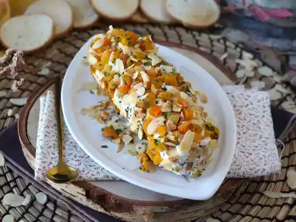 Recept Roomkaas salami met abrikozen en amandelen: het perfecte feesthapje!