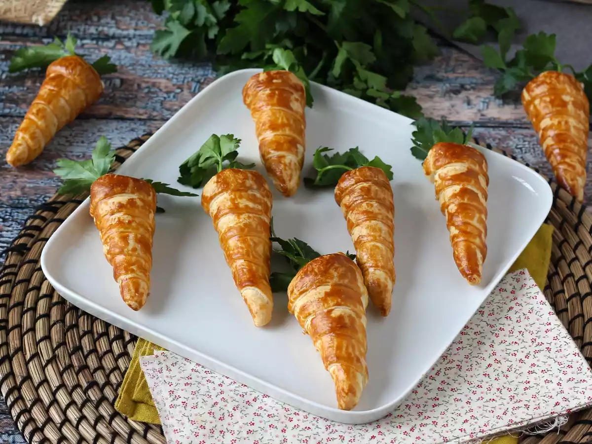 Schattige bladerdeegworteltjes voor een paasaperitief: geitenkaas en zongedroogde tomaatjes
